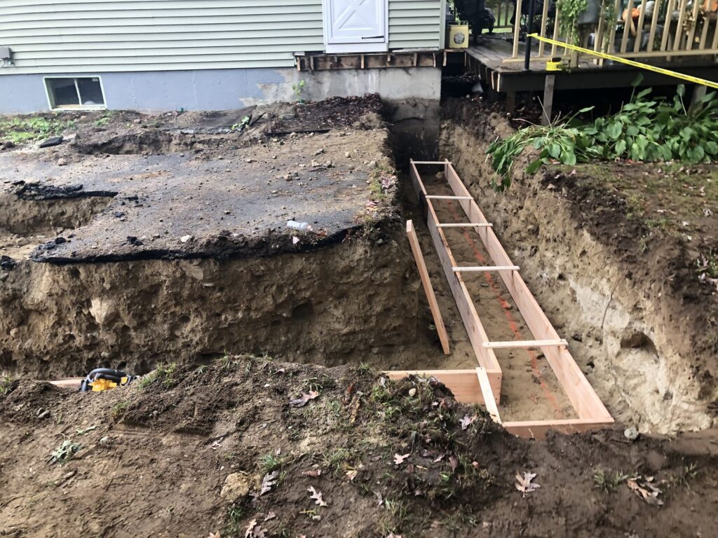 Excavation and footing forms for a Bellingham, MA home addition