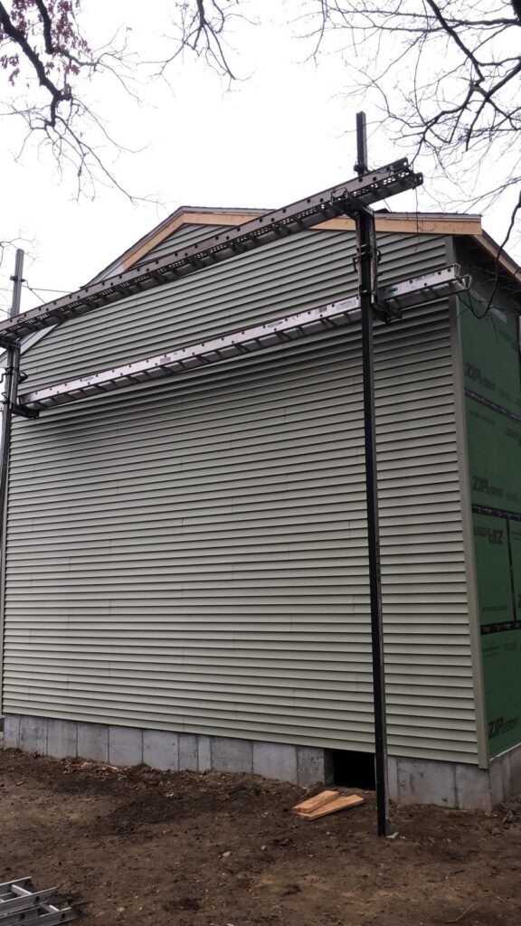 Vinyl siding installation on the Bellingham, MA addition