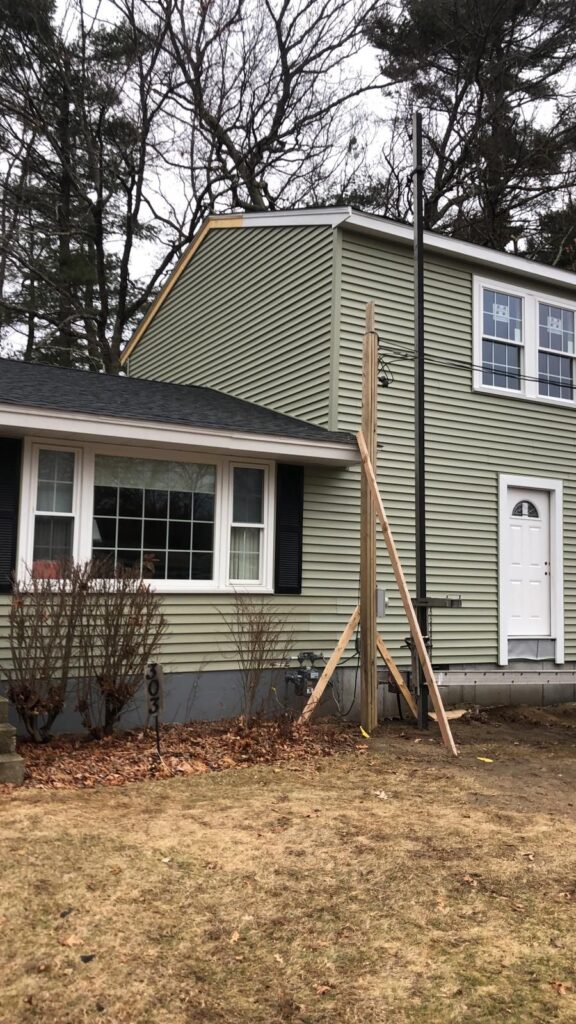Completed house addition with vinyl siding in Bellingham, MA by Appena Properties