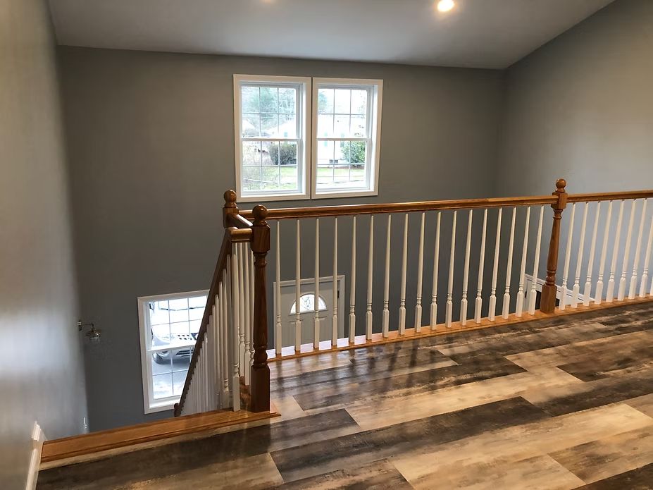 Bellingham, MA house addition by Appena Properties – finished stair landing