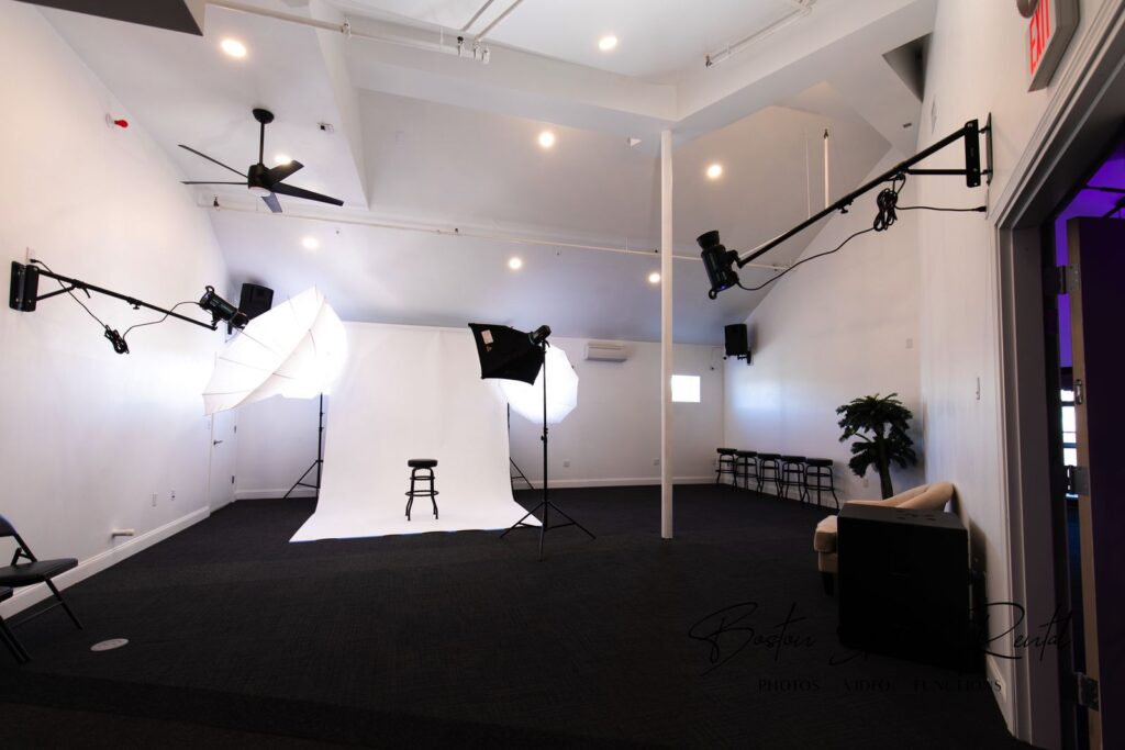 Finished white photo studio with lighting in Boston, built out by Appena Properties