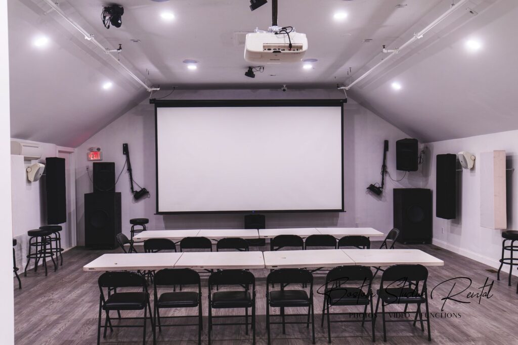 Finished screening and event room with projector screen in the Boston studio