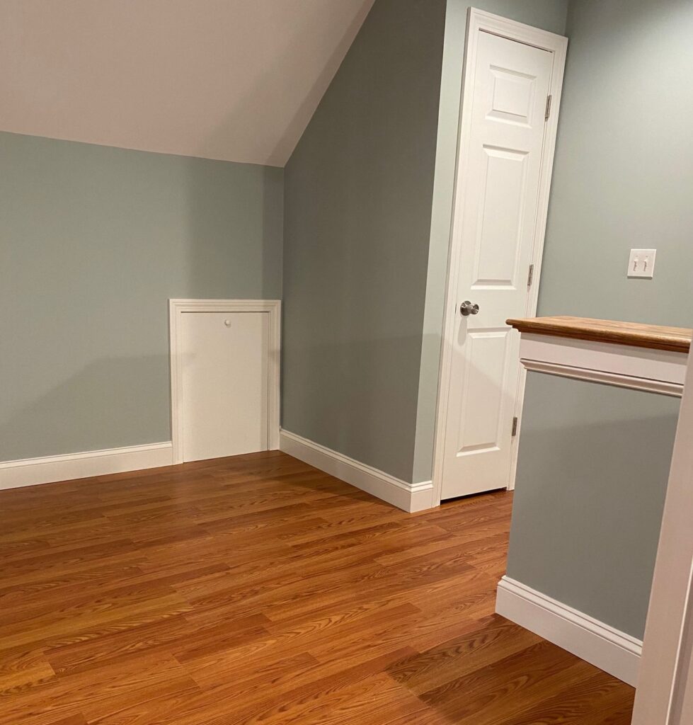 Finished attic with wainscoting and wood floors in Canton, MA