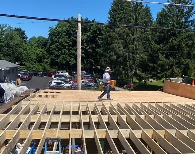Appena Properties crew reframing the roof at Nabnasset Lake Country Club