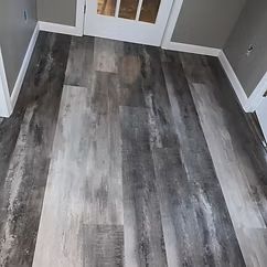 New gray wood-look flooring in a finished room