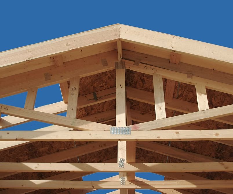 Wooden roof truss framing for new home construction