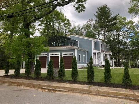 New custom home with glass sunroom in Wellesley, MA built by Appena Properties